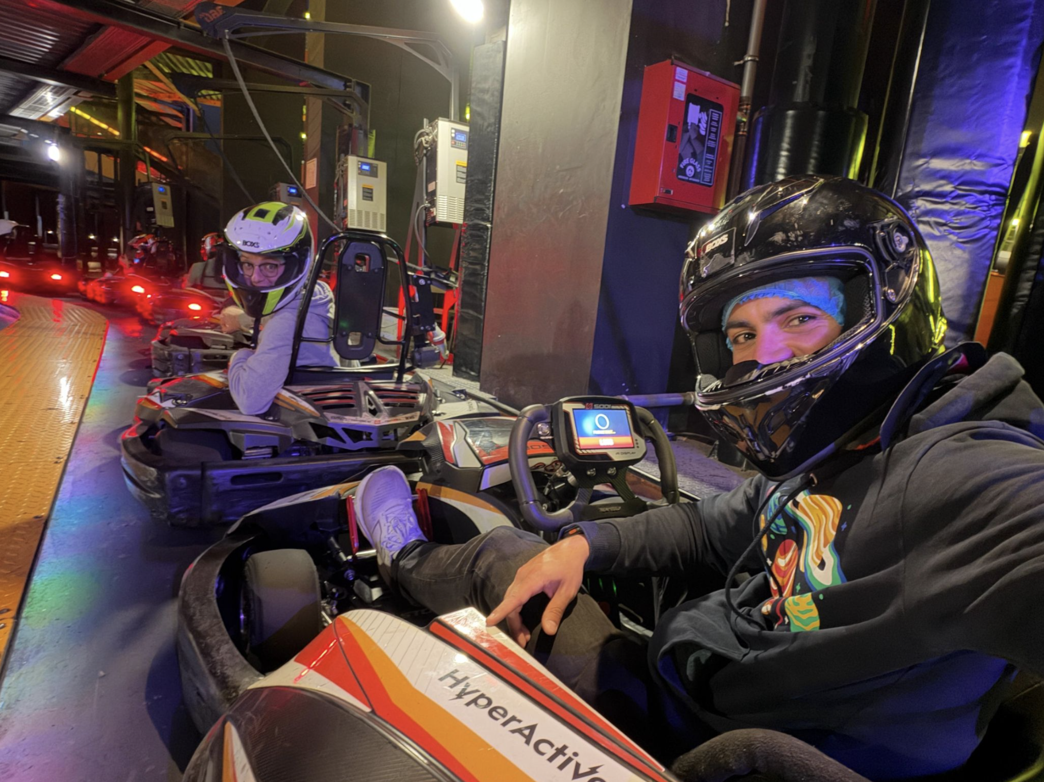 Two Airalo teammates who met through Donut Intros go-kart racing together in Pristina, Kosovo